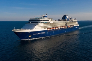 image of the Celebrity Millennium cruise ship cruising through the deep blue waters as the sun shines against the ship