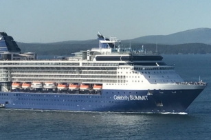 image of the Celebrity Summit cruise ship featuring blue skies and deep blue sea