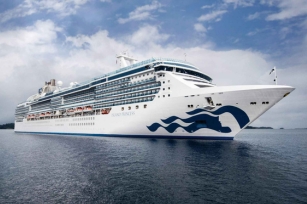 image of the grand princess cruise ship from the front featuring deep blue water and cloudy skies