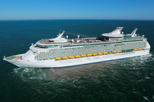 side view of the cruise ship of the Navigator of the Seas against the blue clear skies and blue or green waters